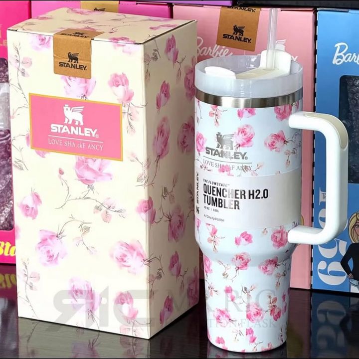 Floral-patterned Stanley tumbler with packaging in the background