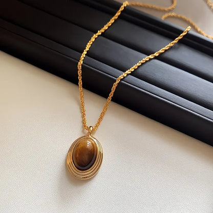 Golden Stainless Steel Necklace with Tiger Eye Stone – Fashionable Twisted Design for Women