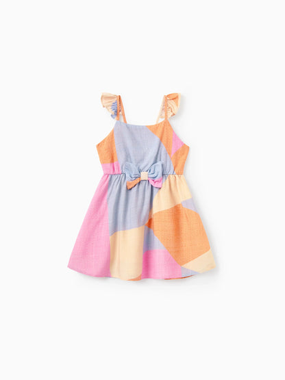 Colorful dress with a bow on a white background
