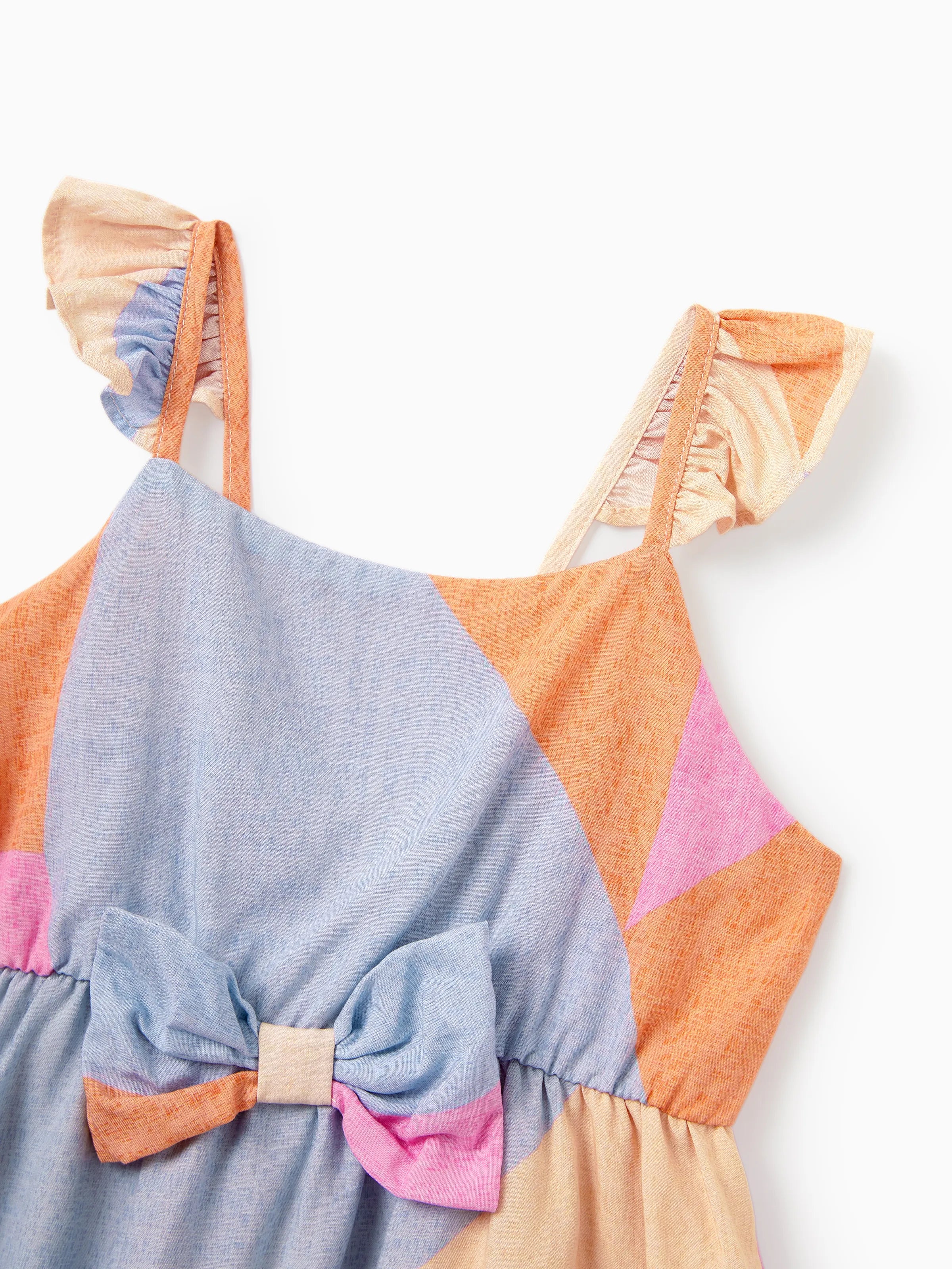 Colorful dress with a bow detail on a white background