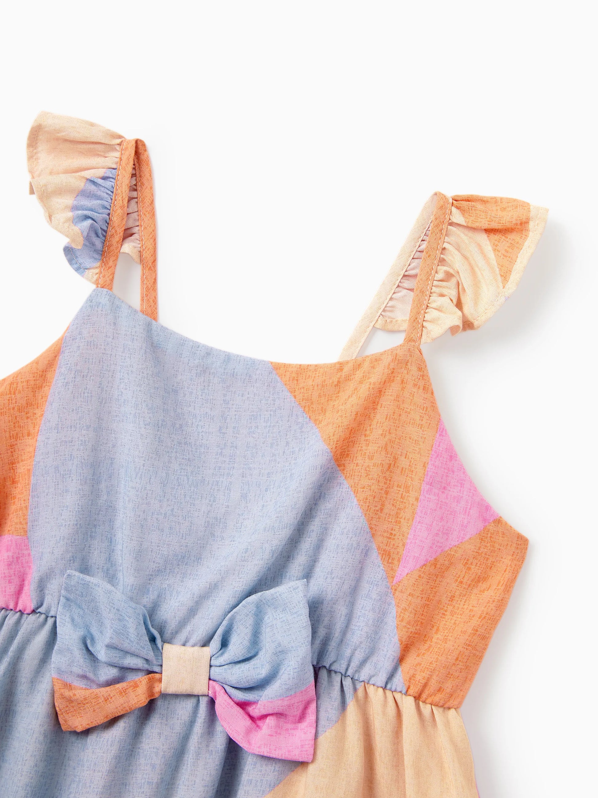 Colorful dress with a bow detail on a white background