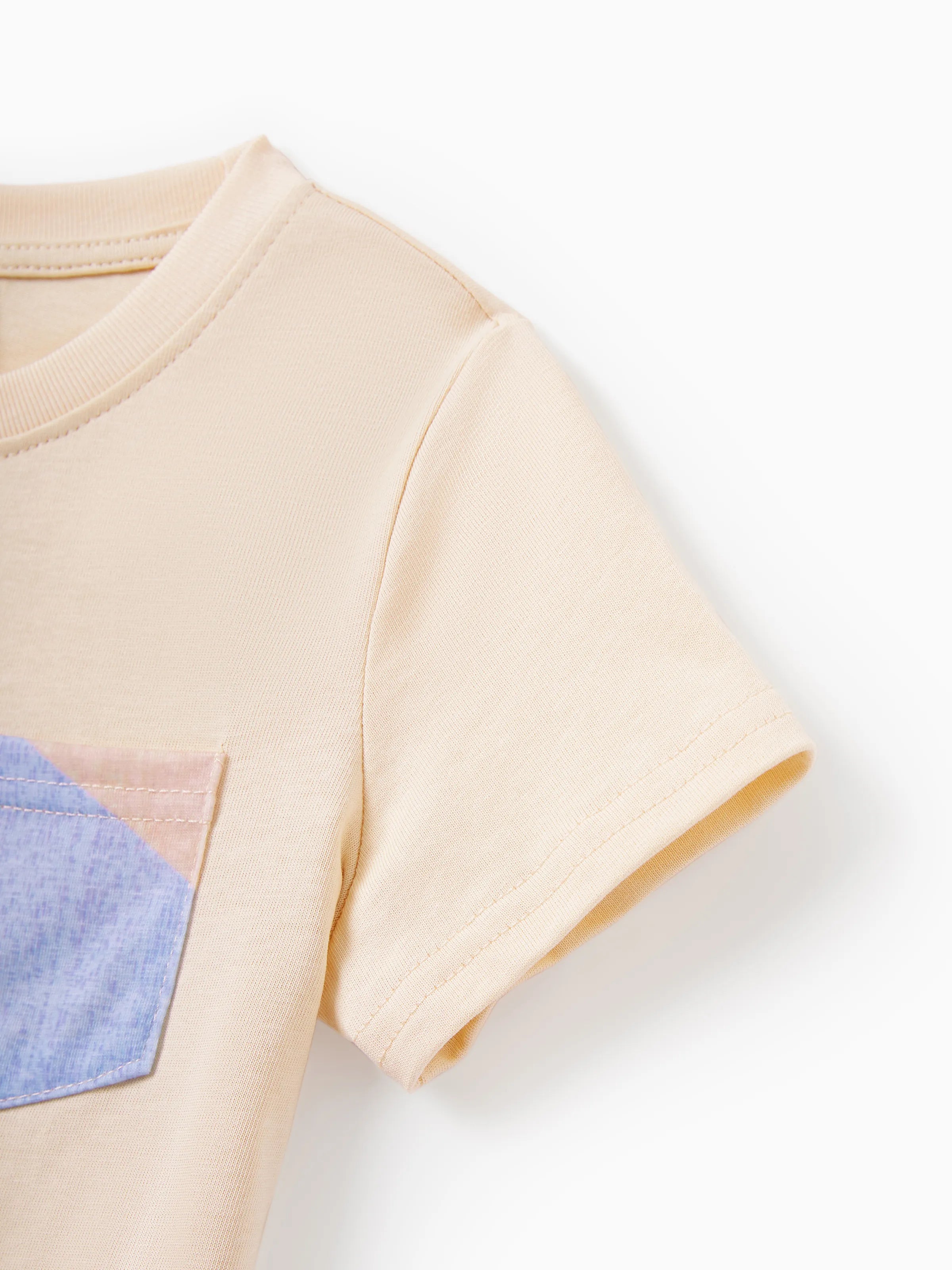 Beige t-shirt with a blue pocket on a white background