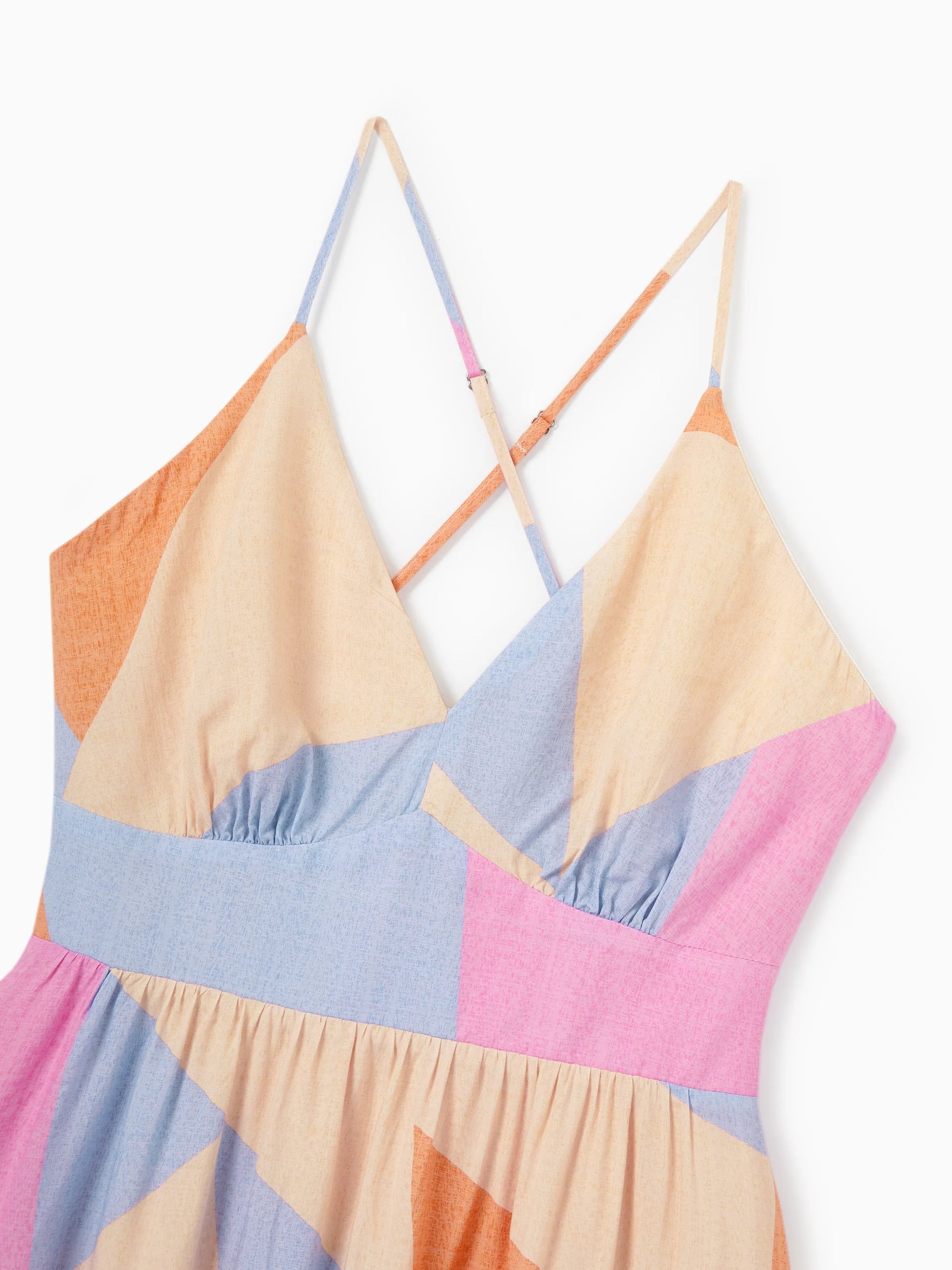 Colorful geometric-patterned dress on a white background