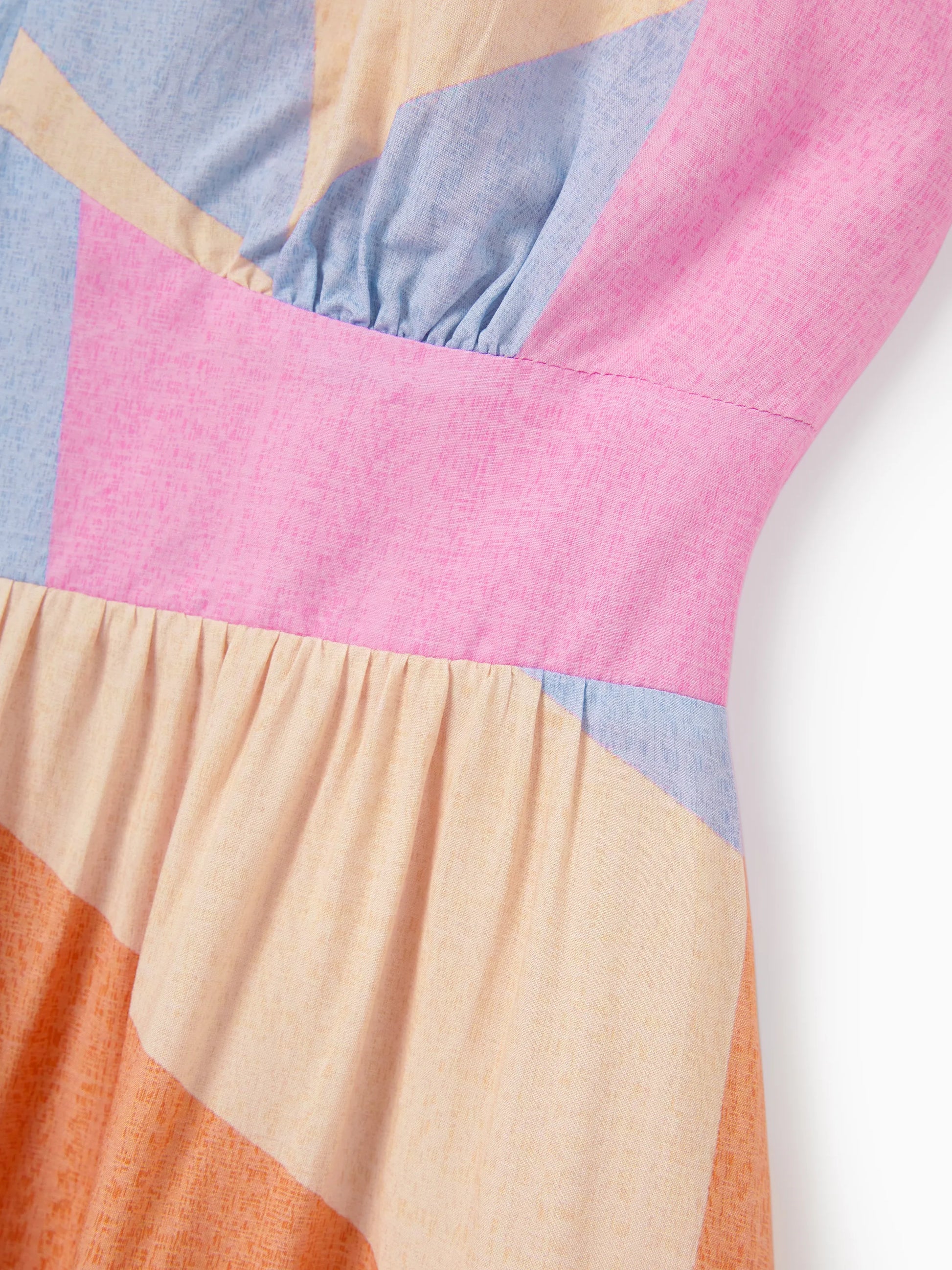 Colorful dress with a geometric pattern on a white background