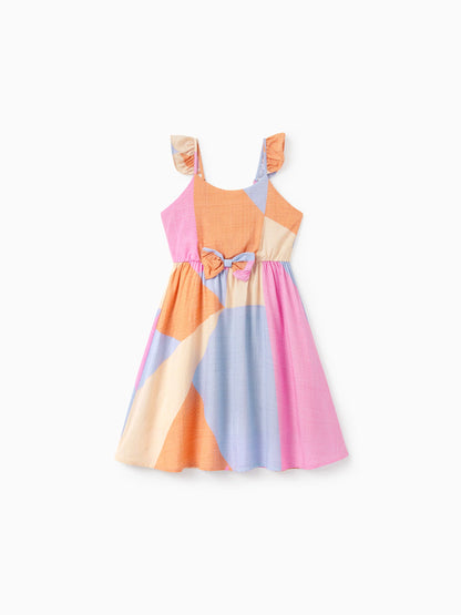Colorful striped dress with a bow on a white background