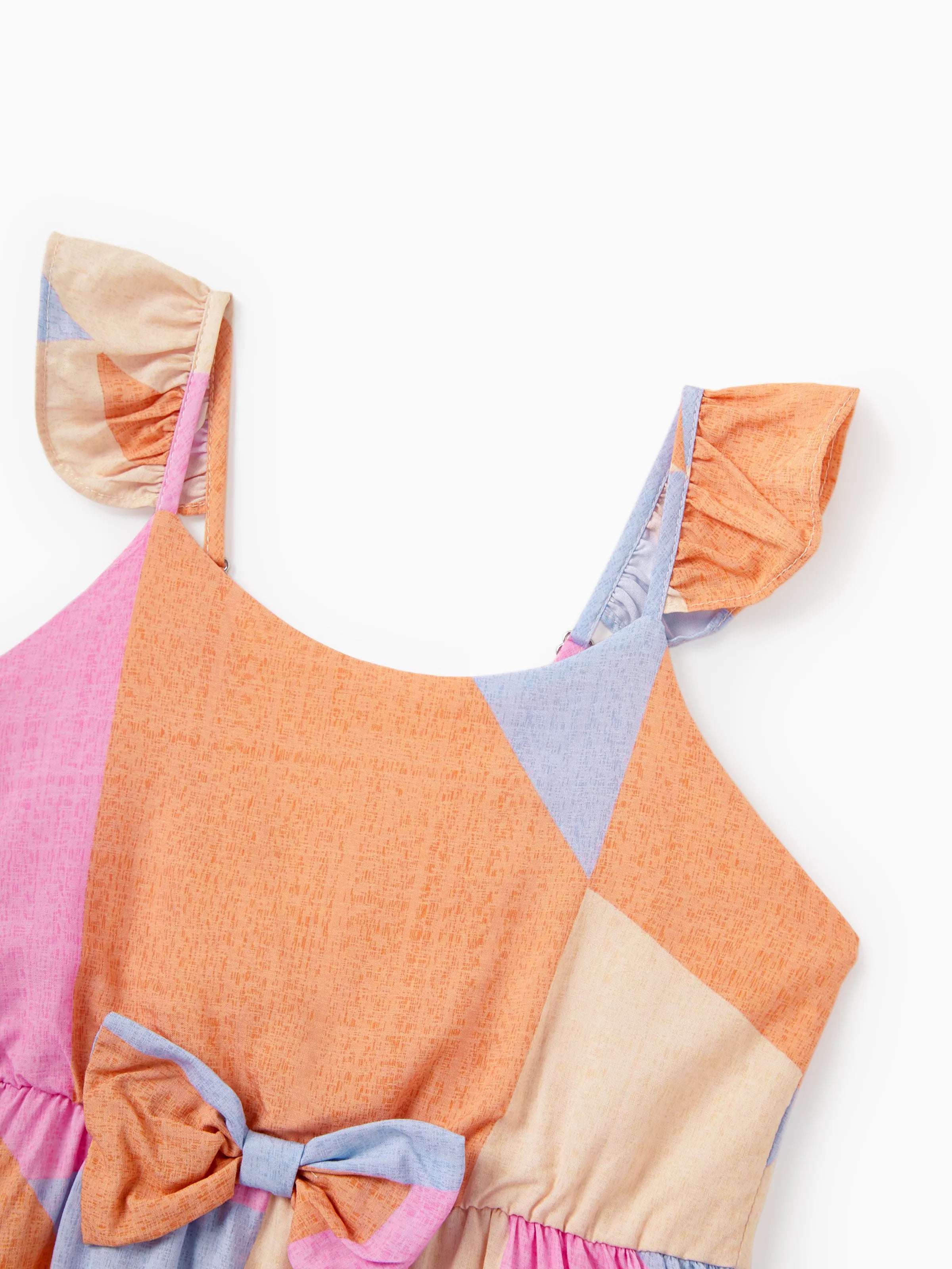 Colorful dress with a patchwork design on a white background