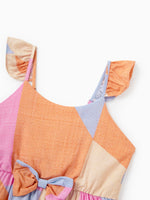 Colorful dress with a patchwork design on a white background